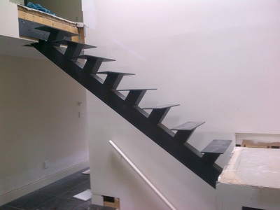 Iron stairs, steel stringers, floating stairs, single stringer stair